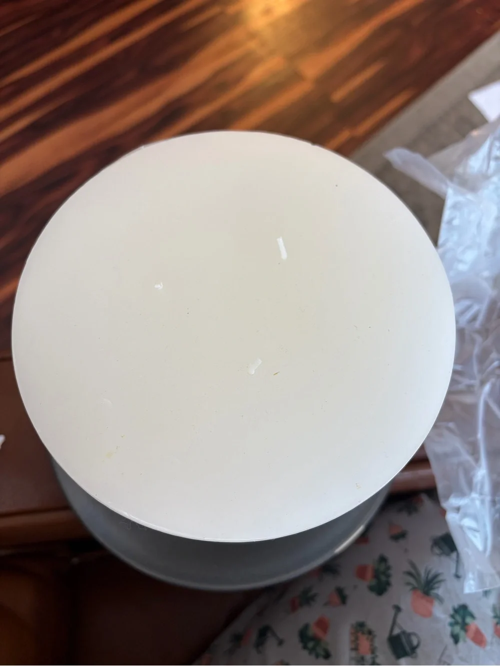 Crate&Barrel Matte Gray Stoneware Charger with Natural Rim and White candle